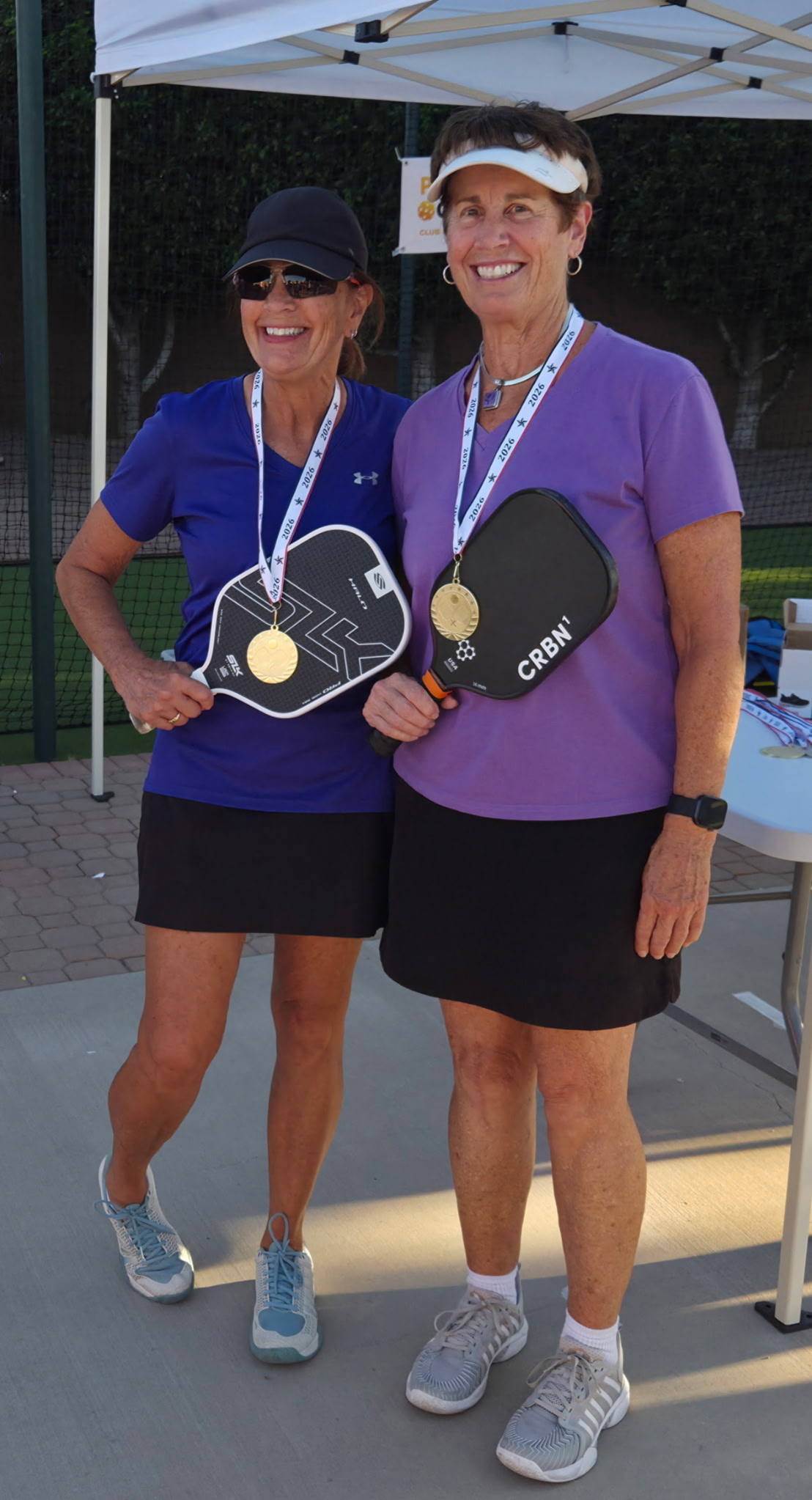 Sheila with her gold medal and paddle